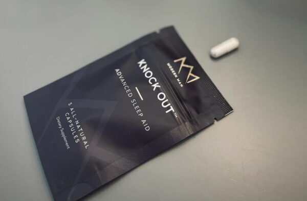 A package of knock out is shown next to a pill.